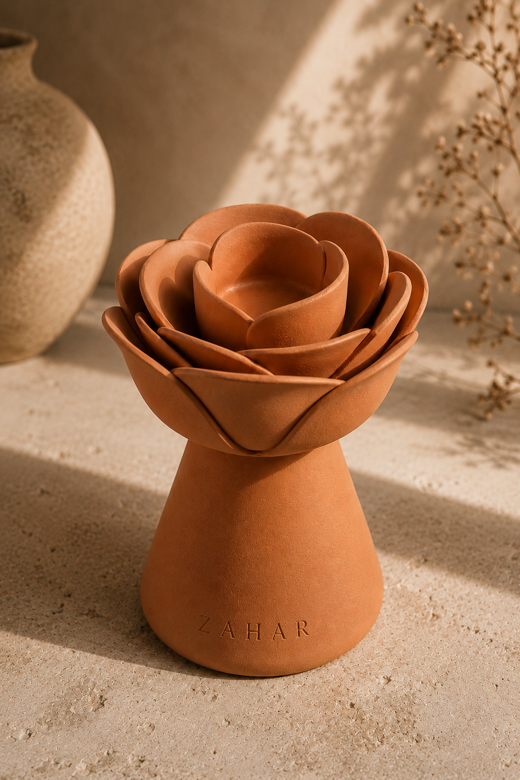 Rose Mubkhar — terracotta rose-shaped mubkhar with ZAHAR embossed on its base, in a warm styled setting